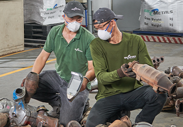 Workers Inspecting Catalytic Converters